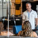 Siling Nurse During Mobile IV Therapy Session